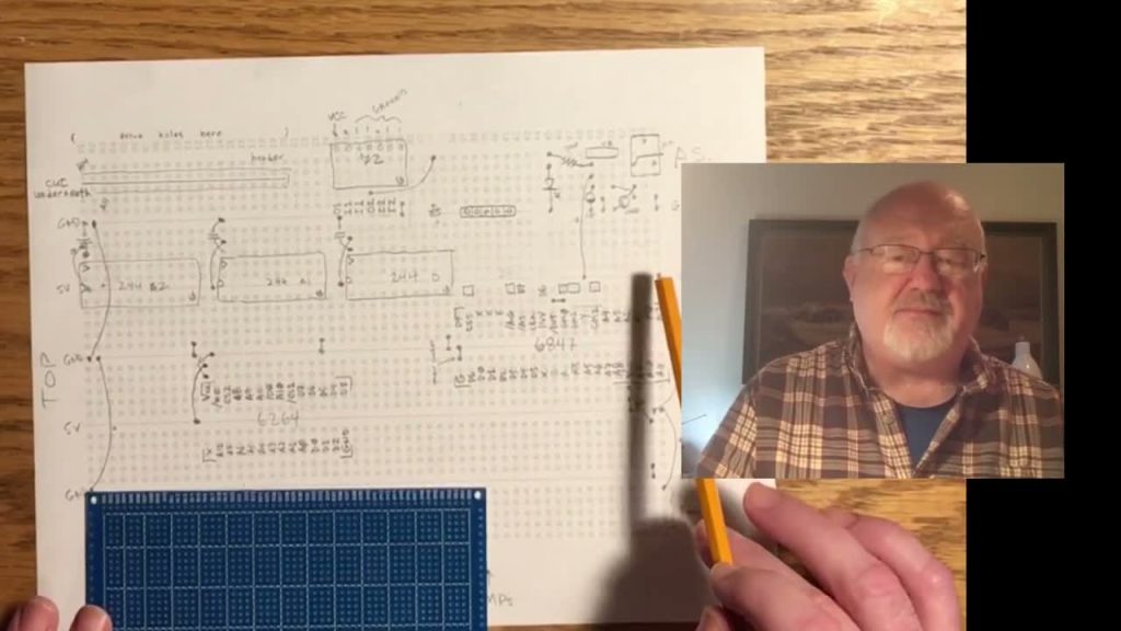 The 6502 Show discusses a hand-drawn video interface schematic beside a prototyping board