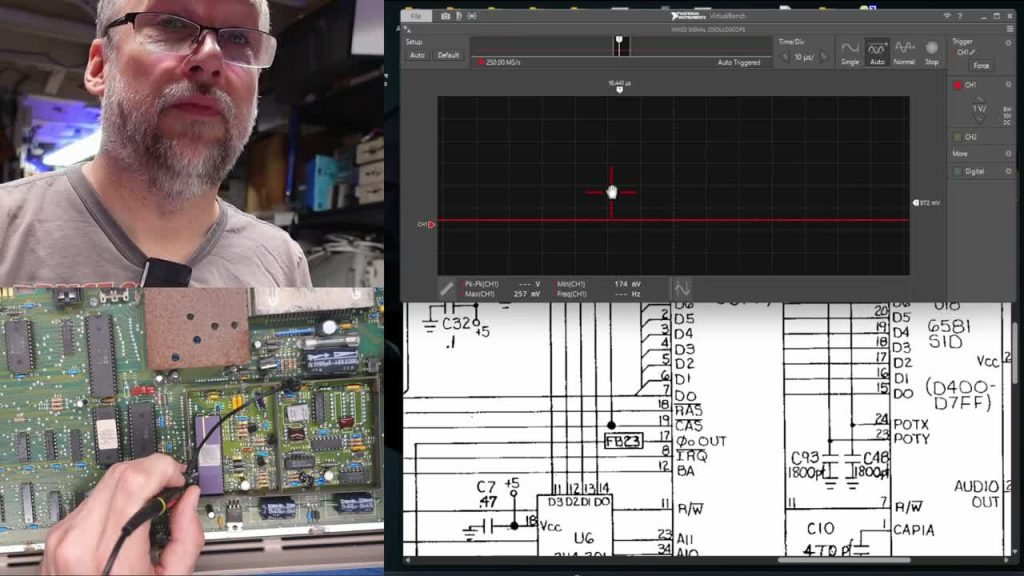 Adrian probes an early Commodore 64 motherboard while viewing a circuit diagram and oscilloscope trace