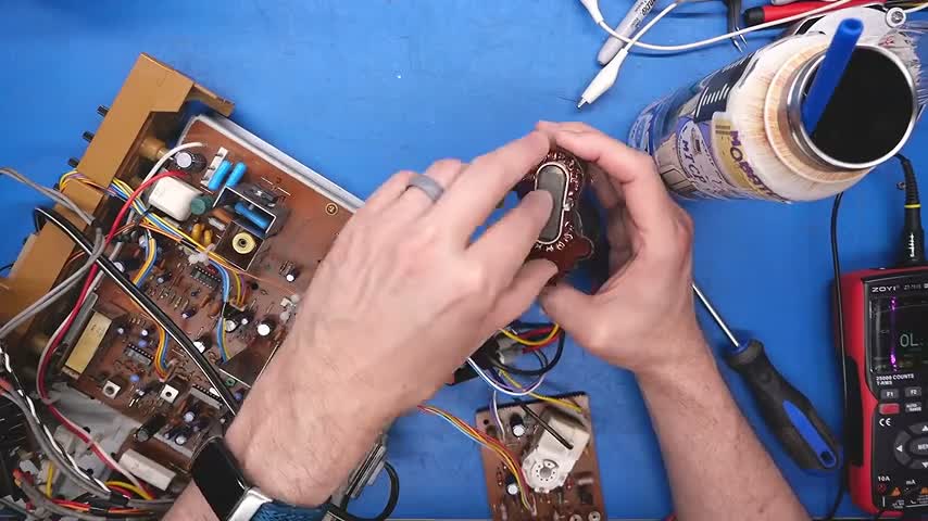 Adrian Black inspects the Commodore 1702 flyback transformer during repair