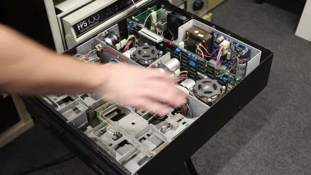 Open dual 8-inch floppy-drive assembly shown in Usagi Electric’s PDP-11 video