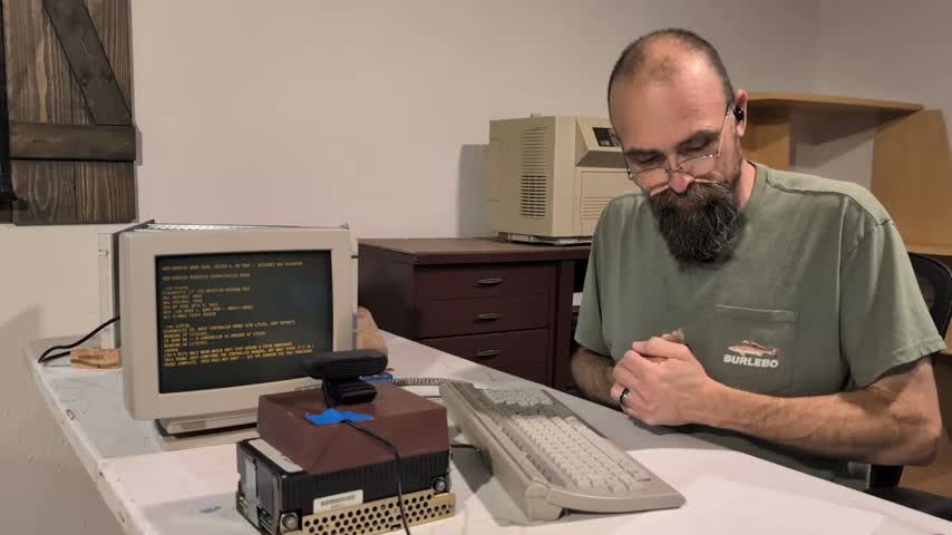 Retro Computing Ranch beside the PDP-11 setup and its boot-screen display
