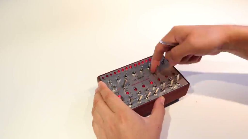 Anders Nielsen operating the Toggle65 switch-and-LED front panel